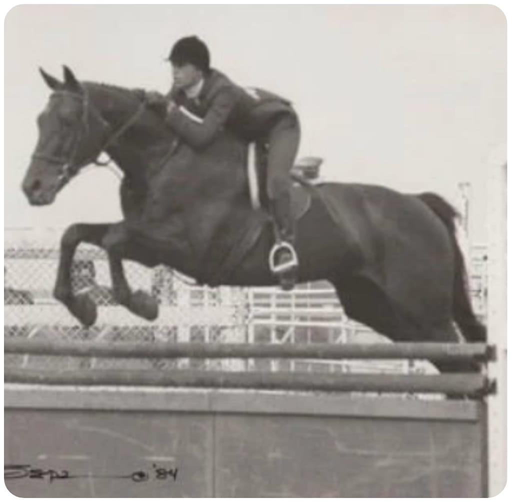 Michelle jumping in a horse show, 1984